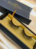 Blush strip lashes in open black and gold Winked x Kari signature lashes box on champagne satin fabric