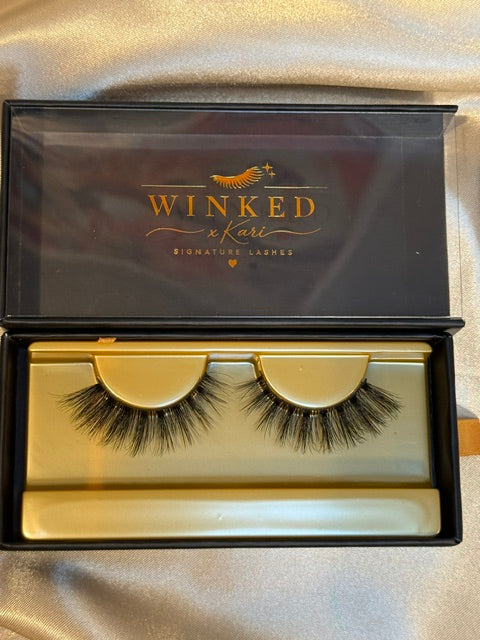 Subtle strip lashes close up in gold Winked x Kari tray showing soft natural volume
